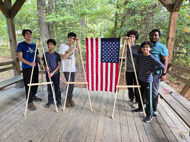 Scouts after constructing 3 tripods at a campout.